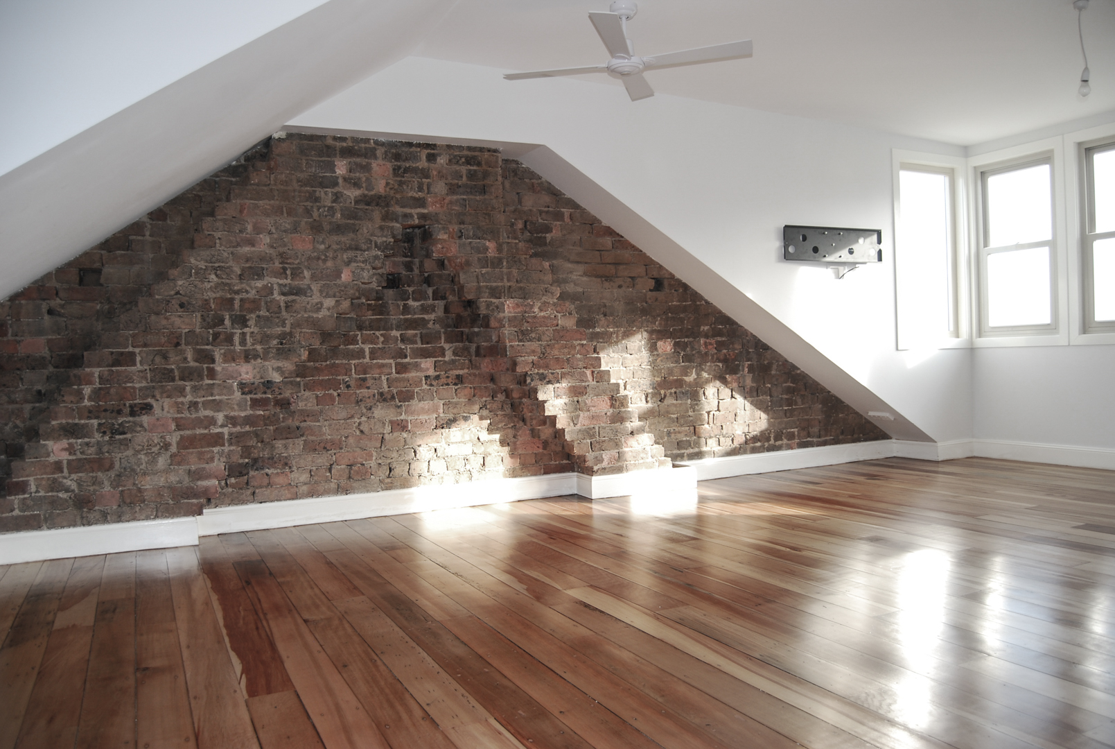 Existing brickwork combined with new walls in attic conversion